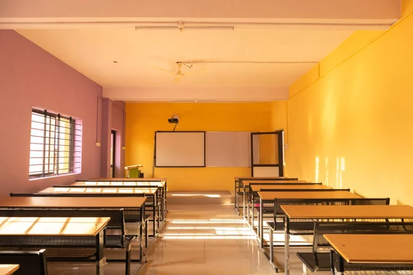 Empty class room and desks with colorful walls