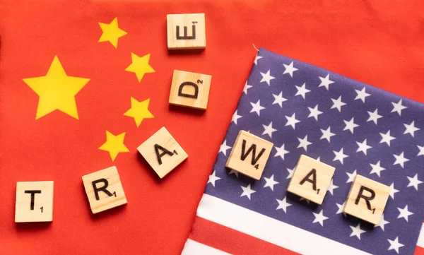 Maski, India 29,May 2019 : China-US trade war concept - flag of China and the United States with wooden block letters