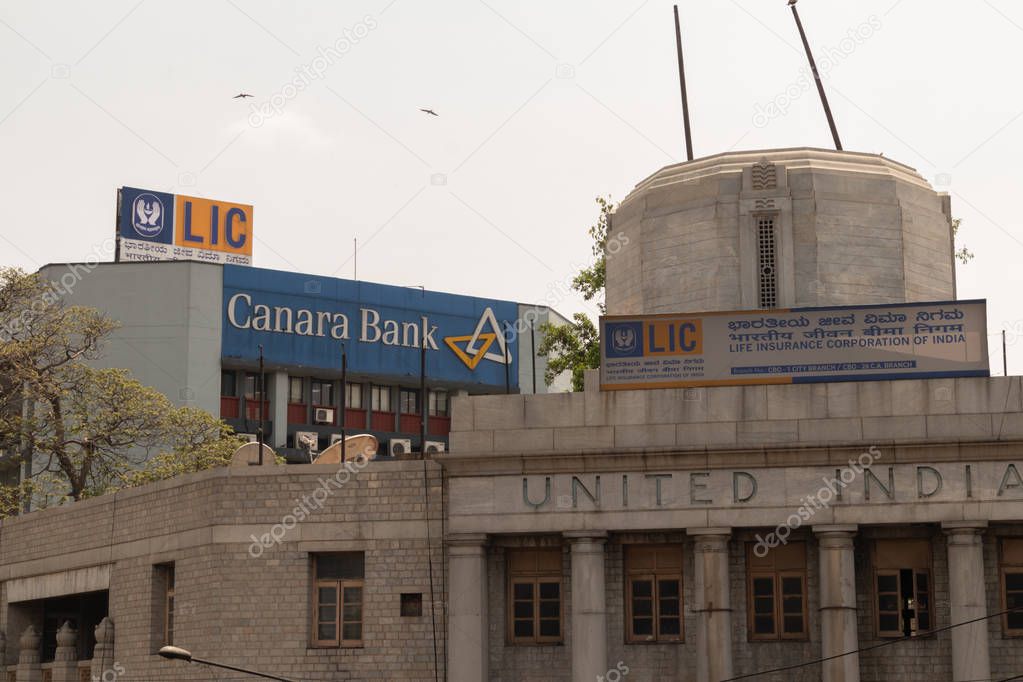 Bangalore, Karnataka India-June 04 2019 : LIC or life insurance corporation of India and Canara bank billboard on top the building at bengaluru,India.