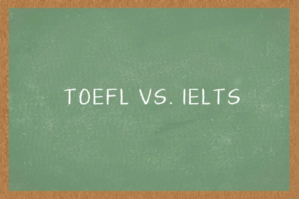Word TOEFL vs. IELTS , Green Chalkboard background. Test of English as a Foreign Language exams.