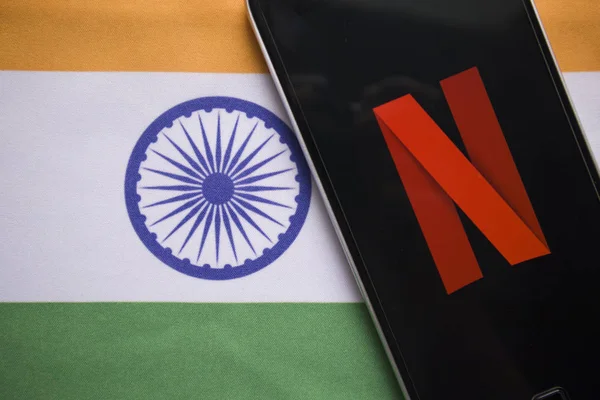 Maski, India - July 30, 2019: Netflix logo on Mobile with Indiain Flag as background. — Stock Photo, Image