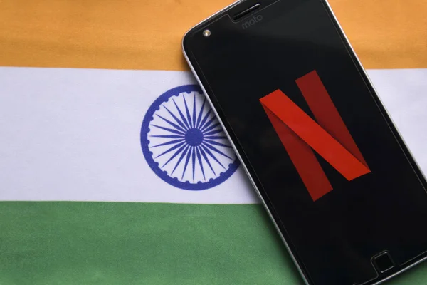 Maski, India - July 30, 2019: Netflix logo on Mobile with Indiain Flag as background. — Stock Photo, Image