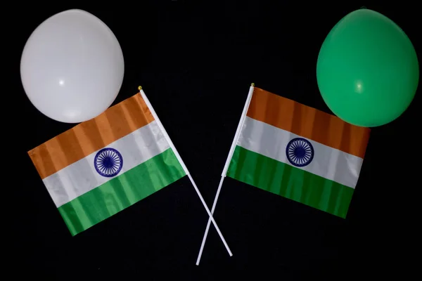 Colorful balloons with India flags on a black background