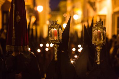Marchena, SEVILLE, SPAIN - March 30, 2018: Procession of Holy Week('Semana Santa') in Marchena, SEVILLE. Holy Friday afternoon. Procession of the Brotherhood of Christ of Saint Peter clipart