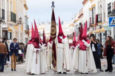 Marchena, SEVILLE, SPAIN - April 18, 2019: Procession of Holy Week in Marchena, Seville. Holy Thurstday. Procession of the Brotherhood of Sweet Name of Jesus clipart