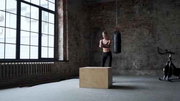 Fit Athletic Woman Does Box Jumps Deserted Factory Gym — ストック動画