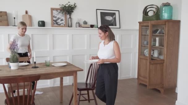 Young Woman Sets Table Dinner Woman Setting Table Stylish Kitchen — Stock Video