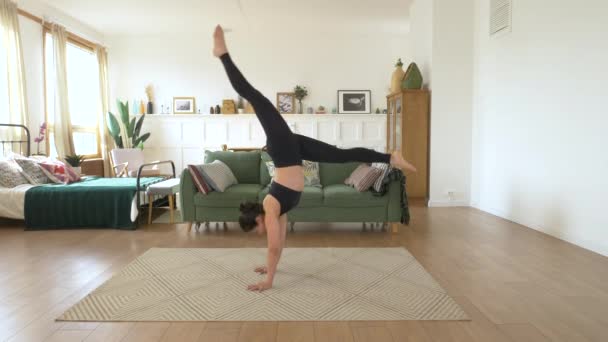 Young Indian Gymnast Ballerina Trains Home Doing Handstand Exercise Bright — Stock Video