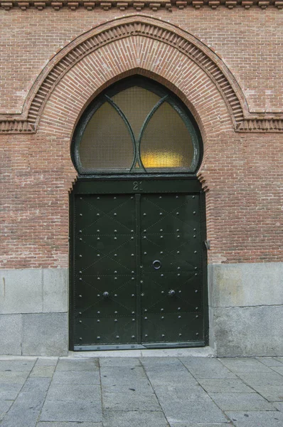 Brick Facade Building Iron Gate Horseshoe Arch — Stock Photo, Image