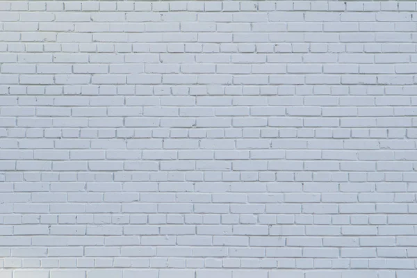Pared de ladrillo pintado con pintura blanca como fondo Imagen de archivo