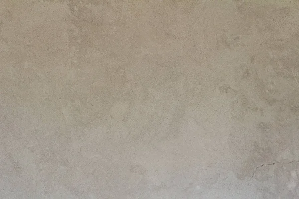 Kum gri renkli doku kesintisiz boş kum duvar kökenli