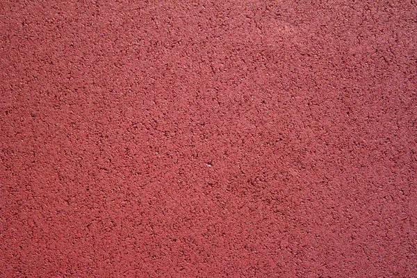Textura de borracha vermelha cobrir chão para parques infantis . — Fotografia de Stock
