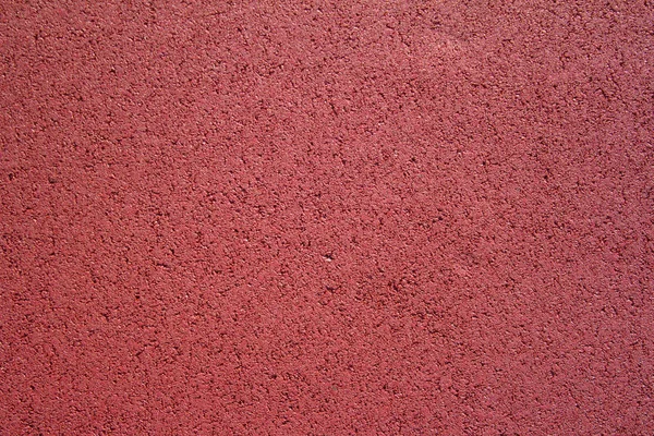 Couverture de texture en caoutchouc rouge pour terrains de jeux pour enfants . — Photo