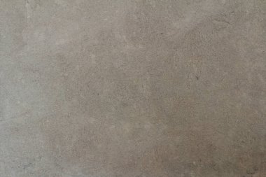 Kum gri renkli doku kesintisiz boş kum duvar kökenli