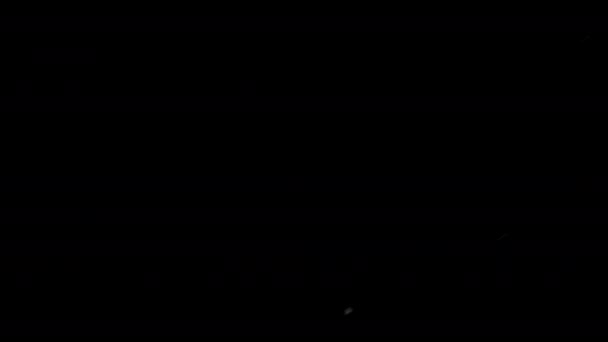 Staubpartikel mit Bokeh auf schwarzem Hintergrund. — Stockvideo