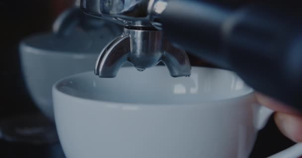 Put a cup for coffee and pouring coffee from coffee machine — Stock Video