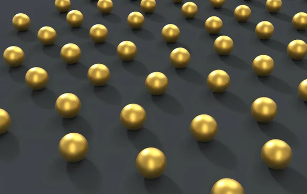 Goldkugeln auf dem dunkelgrauen Boden verstreut — Stockfoto
