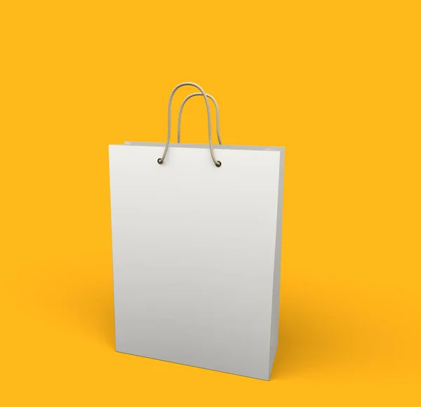 Bílá nákupní taška izolované na žlutém pozadí. — Stock fotografie