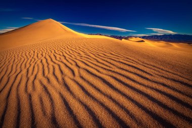 This is a photograph of Death Valley National Park with sand dune textures clipart