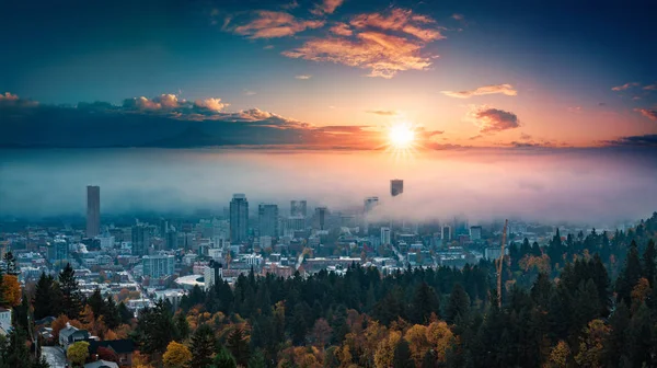 Portland downtown with rolling fog and autumn foliage in shining