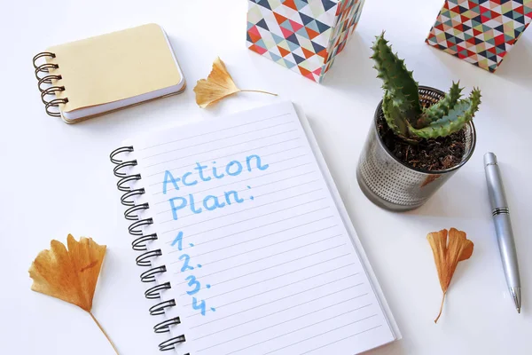 Plan Acción Escrito Cuaderno Sobre Mesa Blanca — Foto de Stock