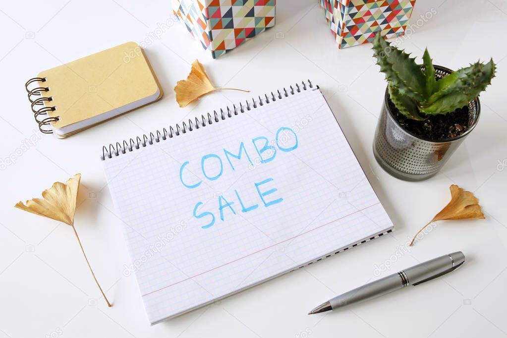 combo sale written in a notebook on white table