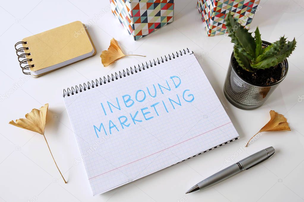 inbound marketing written in a notebook on white table