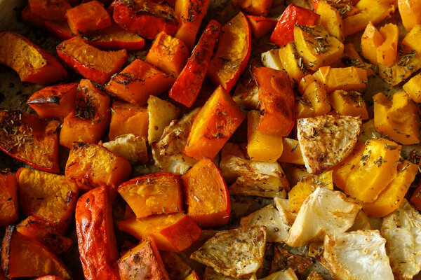 baked autumn vegetables (pumpkin, celery) in herbs