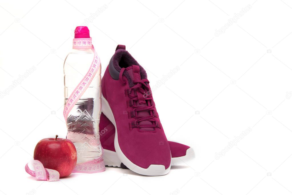  Sneakers, water and fruit on a white background. Sport concept.Copy space
