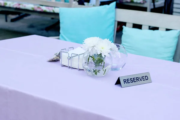 Reserved sign on a restaurant table