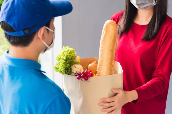 Asian Young Delivery Man Uniform Wear Protective Face Mask Making — Stock Photo, Image