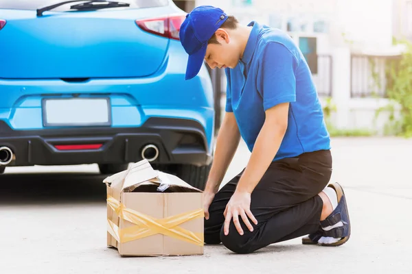 Asian Young Delivery Man Blue Uniform Emotional Falling Courier Hold — Stock Photo, Image