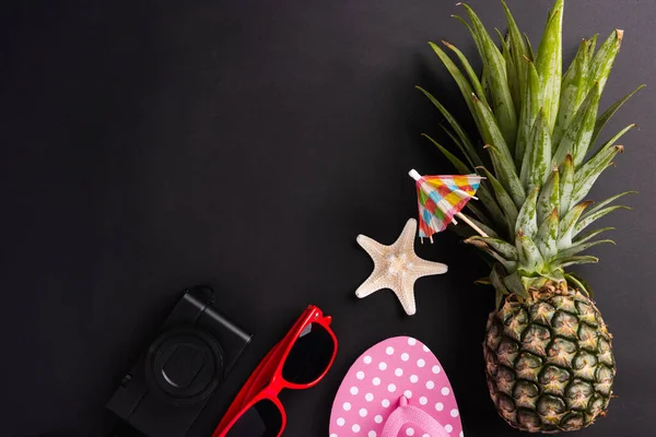 Celebrate Summer Pineapple Day Concept, Top view flat lay of funny fresh pineapple, sunglasses, starfish, slipper and camera, in studio isolated on blank background, Holiday summertime in tropical