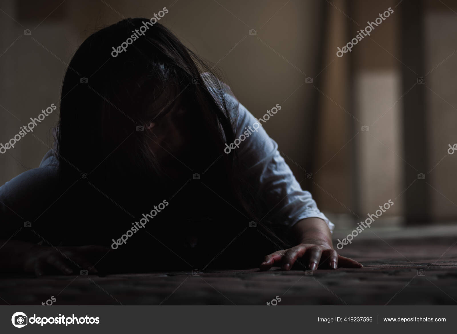 Portrait Of A Scared Girl With Blood On Her Face Looking At Camera