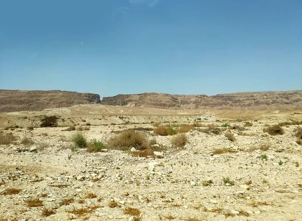 Desert landscape with rocks, hills and mountains