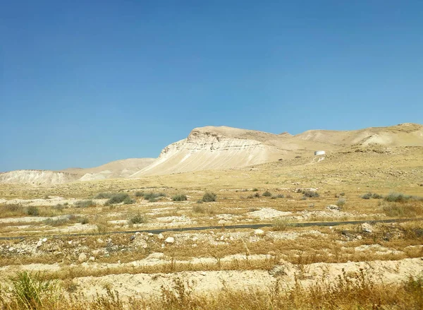 Desert landscape with rocks, hills and mountains