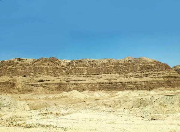 Desert landscape with rocks, hills and mountains