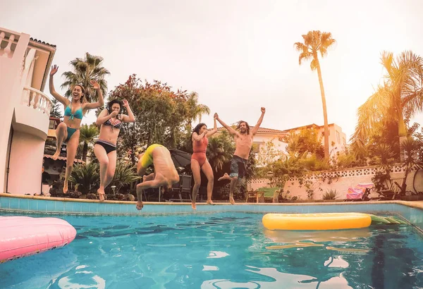 Group Happy Friends Jumping Pool Sunset Time Millennial Young People — Stock Photo, Image