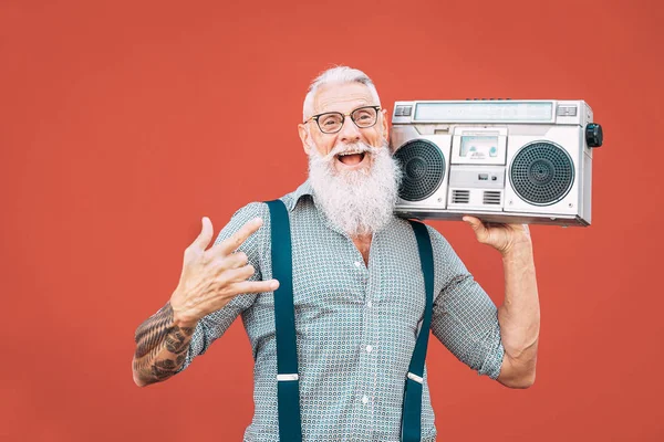 Happy senior man listening to music with boombox outdoor - Crazy hipster male having fun dancing with vintage stereo - Concept of elderly people lifestyle — Stock Photo, Image