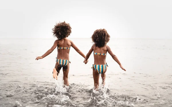 Happy Sisters Running Water Summer Time Afro Kids Having Fun — Stockfoto