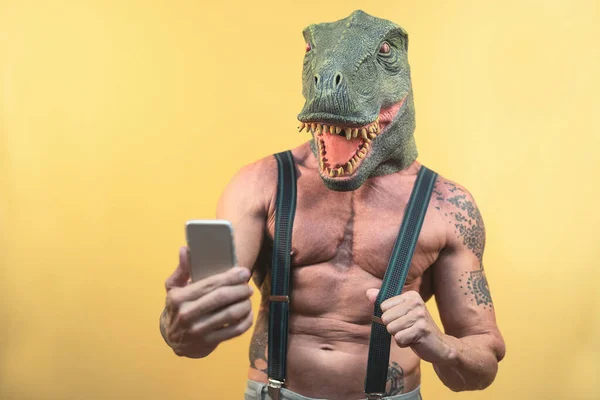 Senior Man Taking Selfie Smartphone While Wearing Dinosaur Mask Mature — Stock fotografie