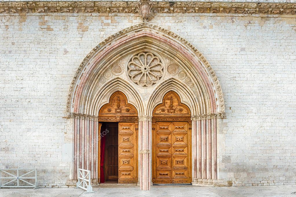 Main portal of the Basilica of Saint Francis, Assisi, one of the most important places of Christian pilgrimage in Italy. UNESCO World Heritage Site since 2000