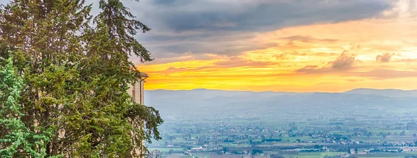 Scenic sunset as seen from Assisi, on the western flank of Monte Subasio, Italy