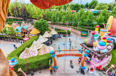 CASTELNUOVO DEL GARDA, ITALY - MAY 1: Aerial view inside Gardaland Amusement Park, near Lake Garda, Italy, May 1, 2018. The park attracts nearly 3 million visitors every year clipart