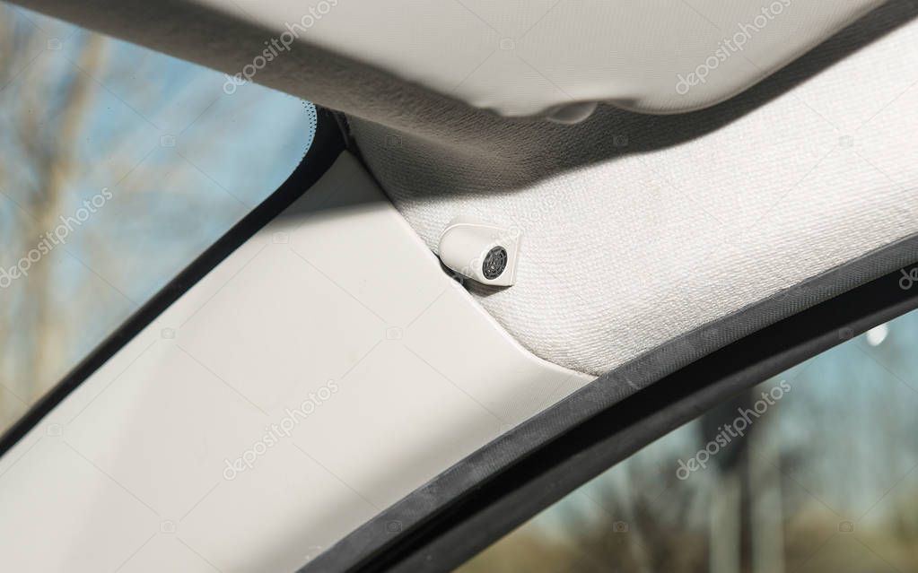 Interior of a car with closeup of  anti-theft alarm sensor