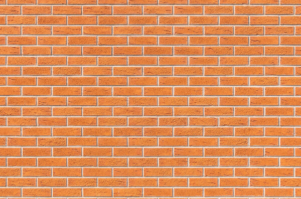 Brickwall background. Light brown brick wall with microcracks. 