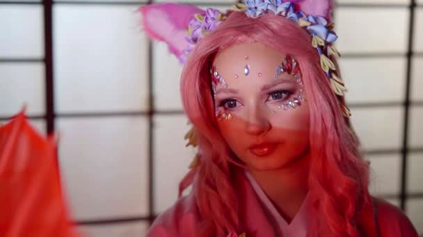Young Woman Is Looking Like A Japanese Anime Character With Pink Hair Funny Cat Ears On Head Video By C Yarmedia Stock Footage Young Woman Is Looking Like A Japanese Anime Character With Pink Hair Funny Cat Ears On Head Video By C Yarmedia Stock Footage