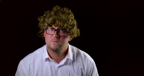 A Close Up Portrait Of A Curly Haired Man In Glasses And A White