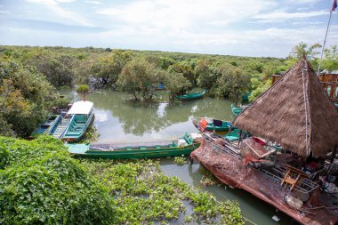 Flood Village name Kampong Phluk floating village at Tonle Sap lake, Siem Reap Province, Cambodia clipart