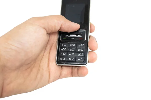 手指拿着老一代手机与白色隔离模具切割背景 1995 2010世纪的传统手机 — 图库照片